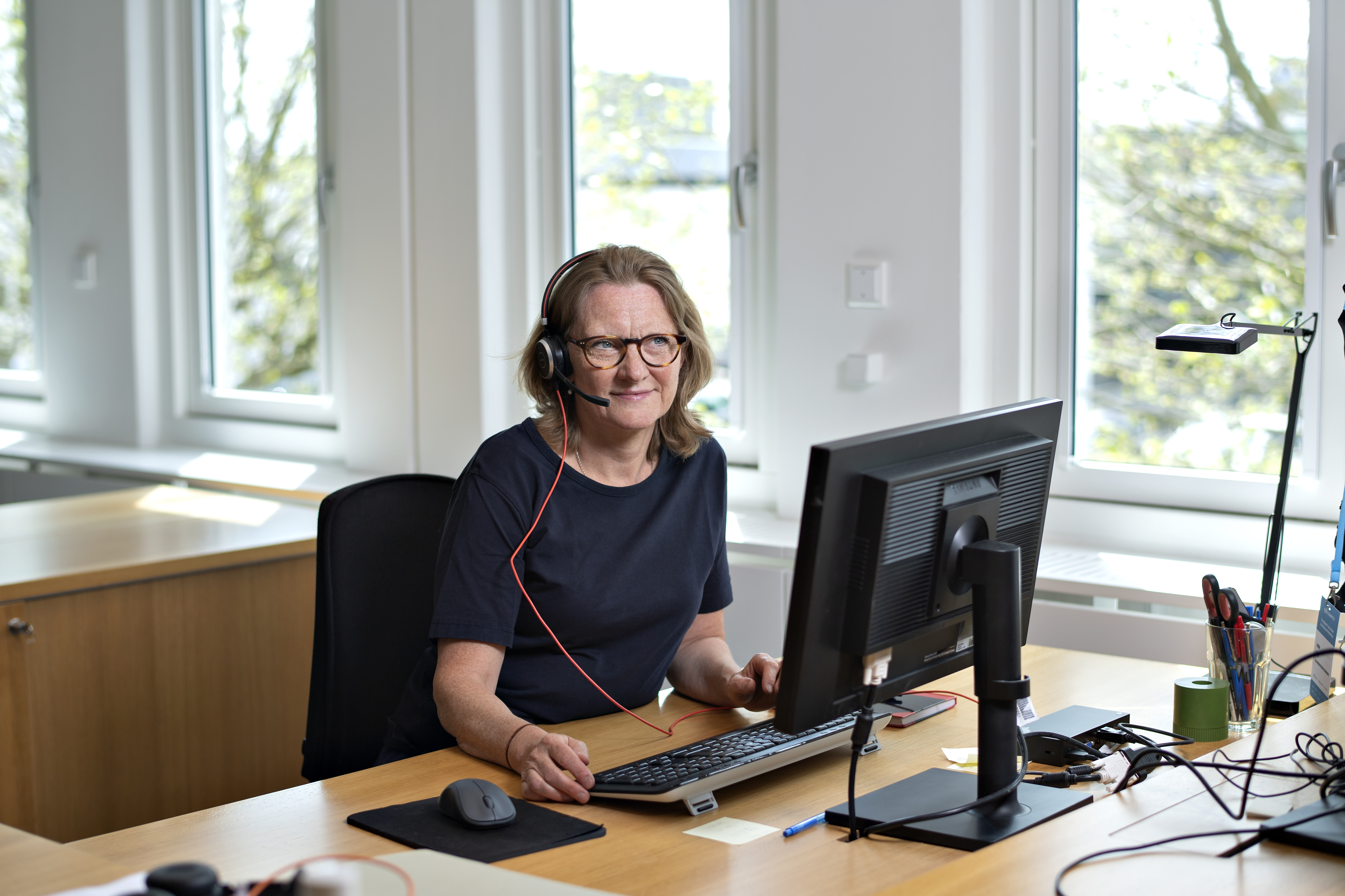 En af specialraadgivningens medarbejdere sidder klar med raadgivning til dig. 